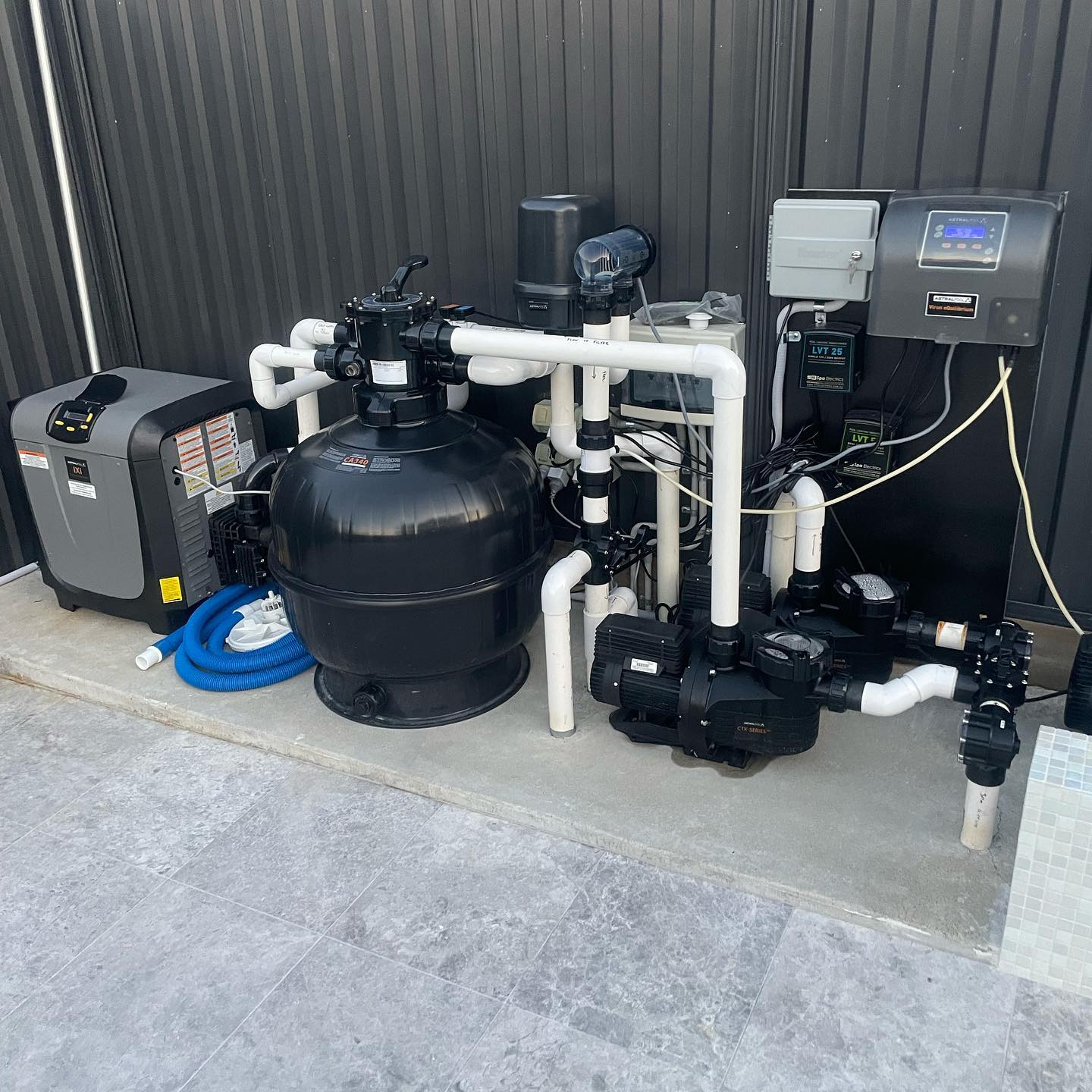 A neatly installed pool pump and filtration setup