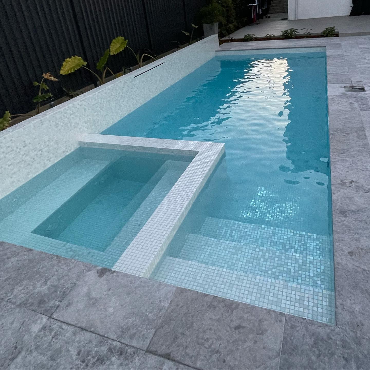 A recently completed concrete pool by The Pool Builders