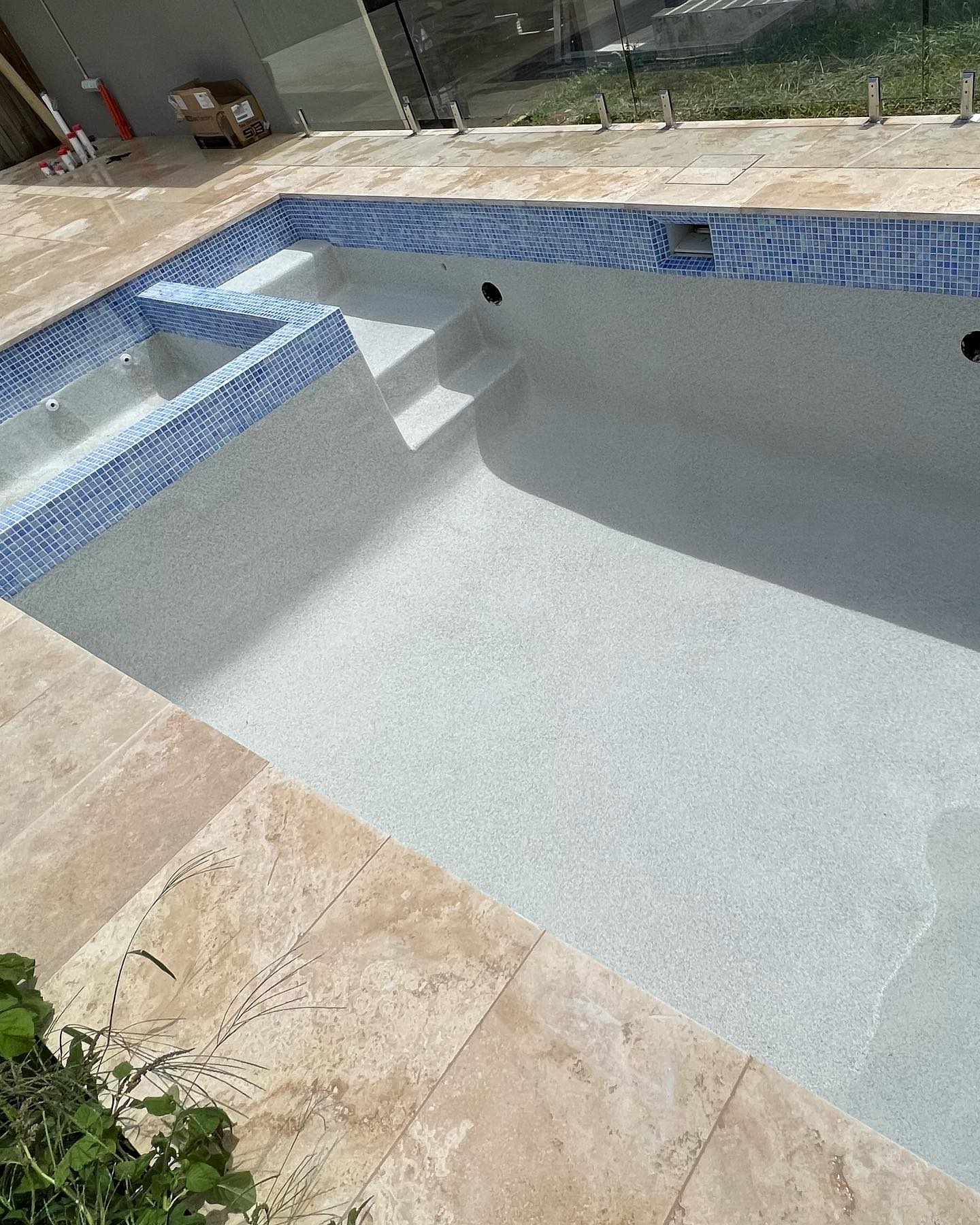 A recently completed concrete pool by The Pool Builders