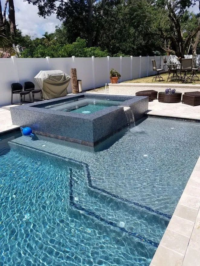 A backyard concrete pool ready for summer