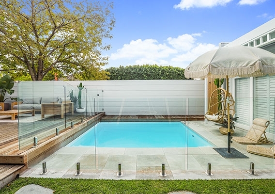 A finished swimming pool with clean tiled edges